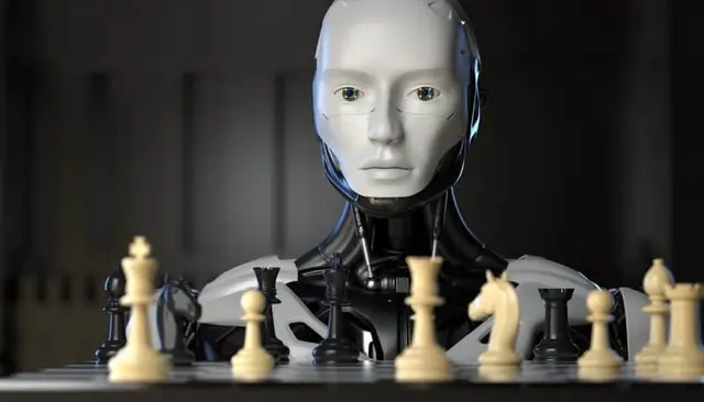 Humanoid robot with a white face in front of a chessboard, with light and dark pieces in the foreground