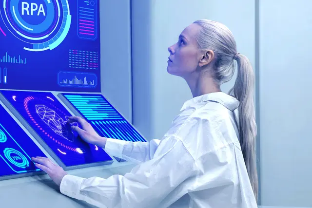 Woman in a white coat facing touch screens with blue indicators and the acronym RPA, in a futuristic laboratory.