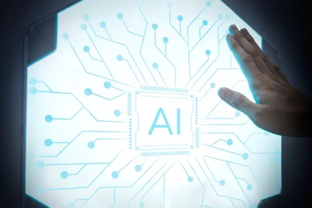 Hand resting on a hexagonal glowing panel with a central chip marked AI and blue circuit traces.